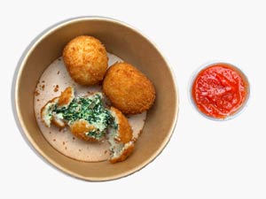 Homemade Italian meatballs served with fresh pasta and tomato sauce at Pastasole NYC