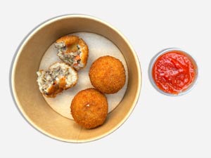 Golden crispy arancini filled with risotto and mozzarella, Italian appetizer from Pastasole NYC