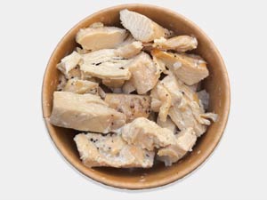 Creamy chicken pasta tossed in Parmesan wheel, signature dish from Pastasole New York